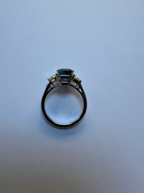 Emerald cut aquamarine and diamond three stone ring
