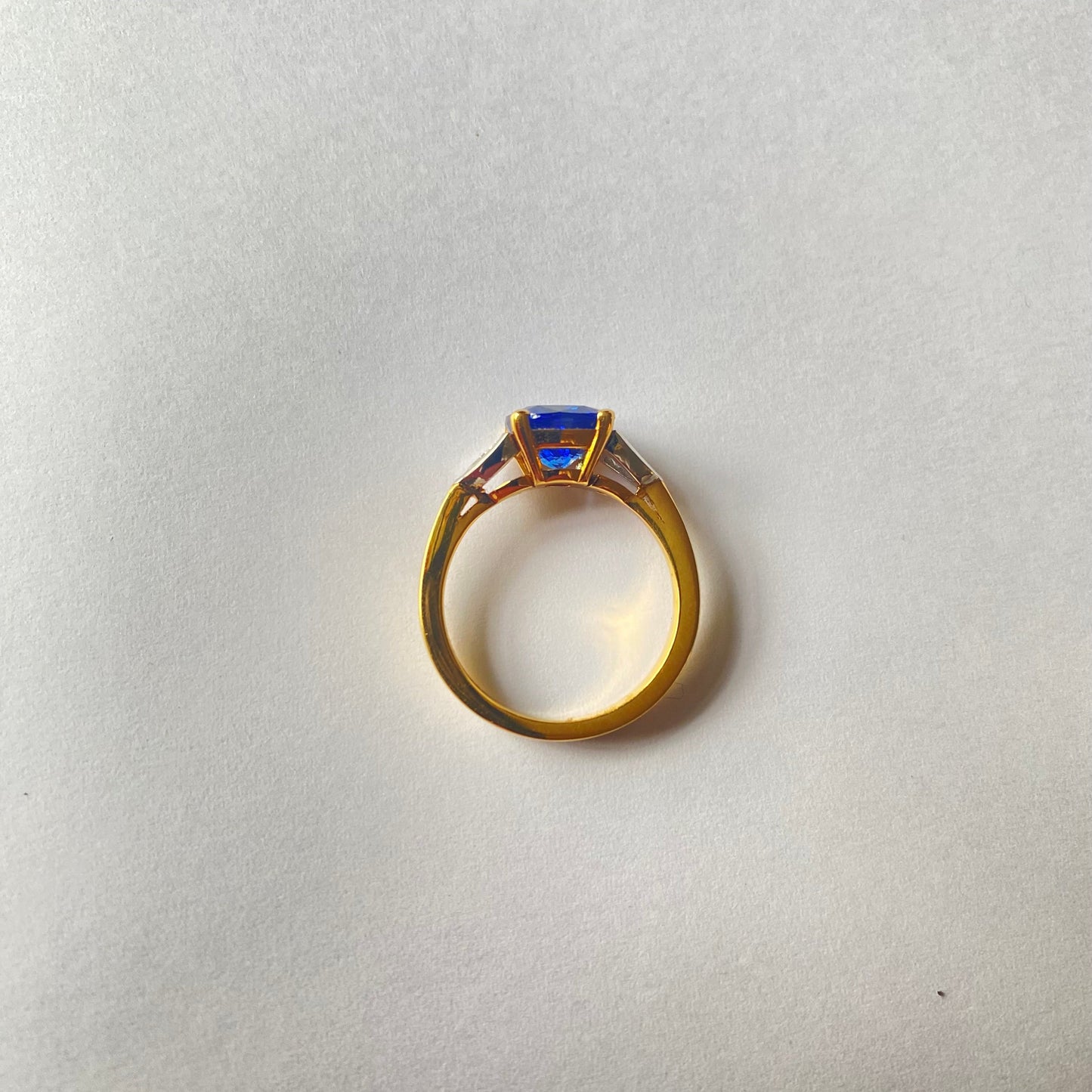 Cushion cut Ceylon sapphire and diamond three stone ring