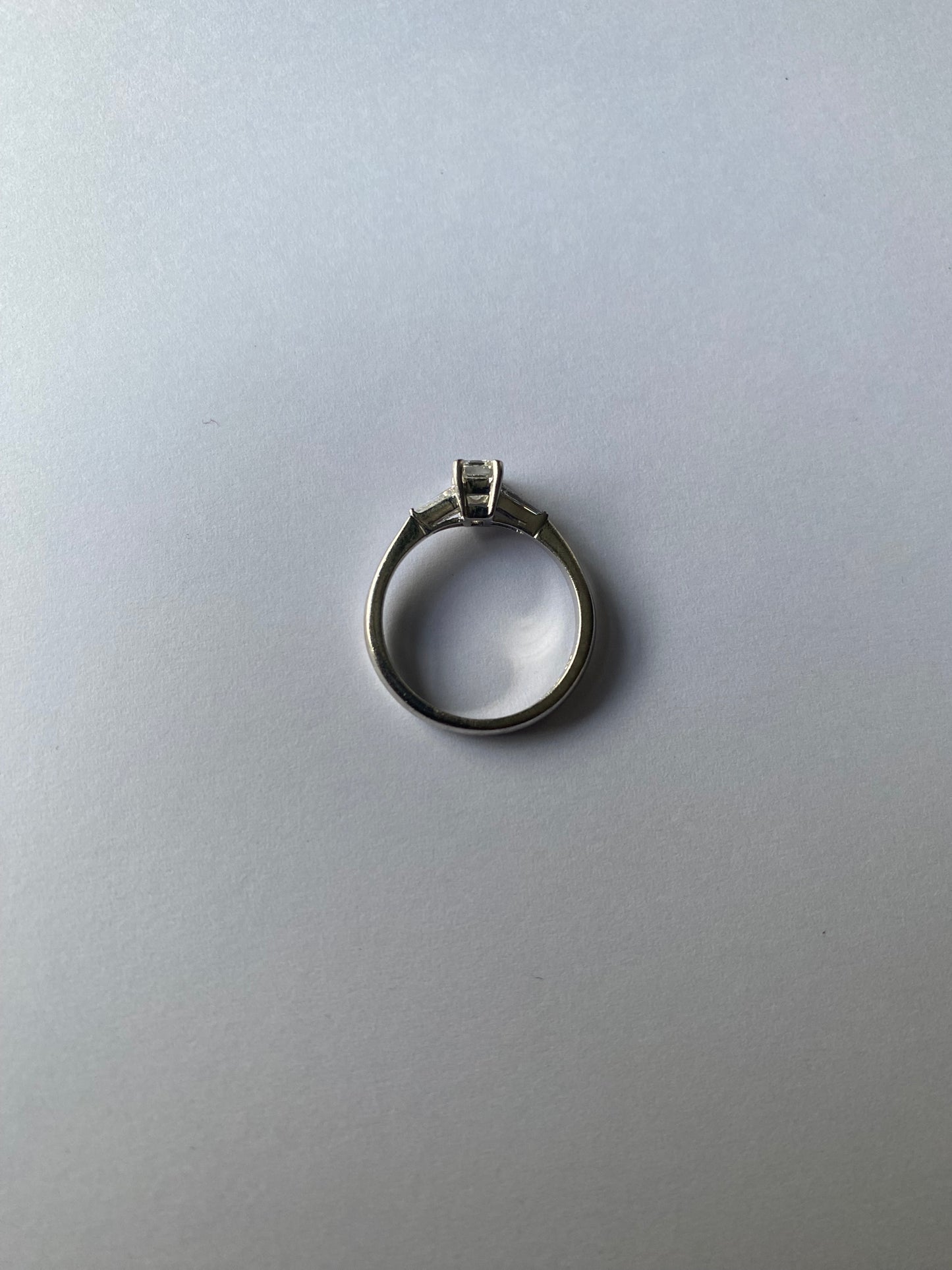 Emerald cut and tapered baguette cut diamond ring