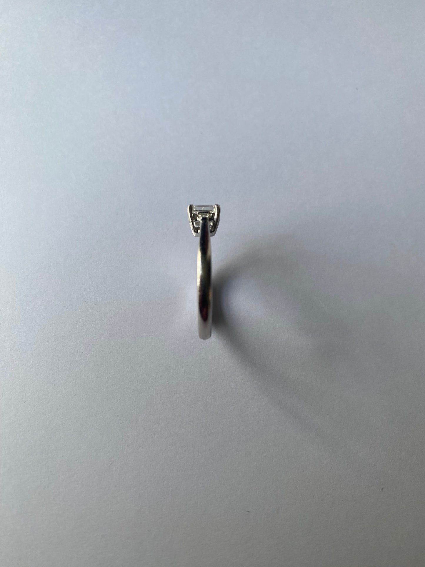 Emerald cut and tapered baguette cut diamond ring