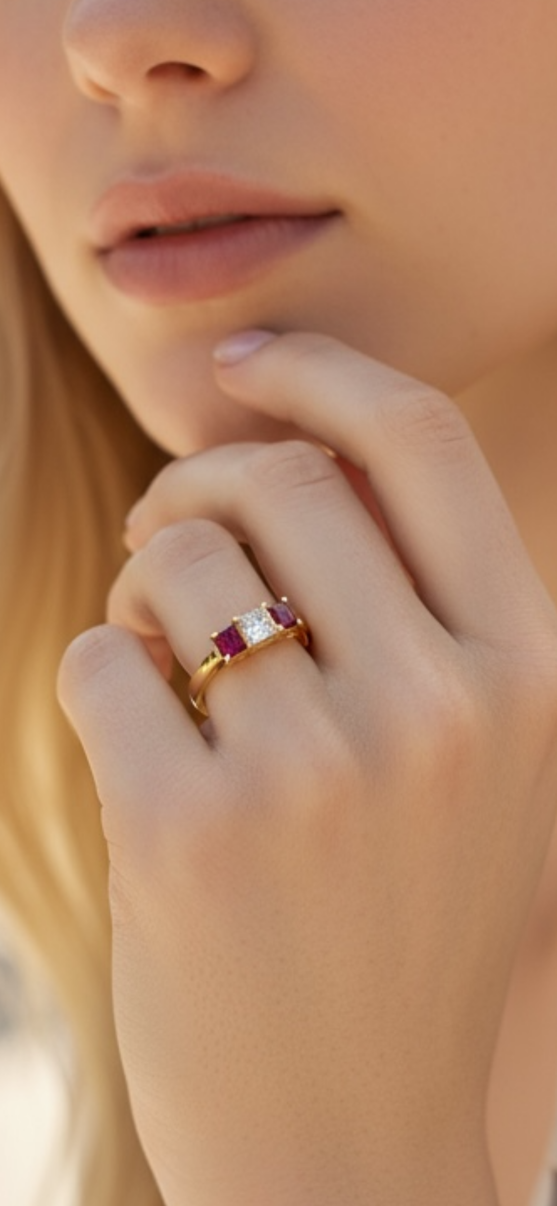 Princess cut diamond and ruby three stone ring