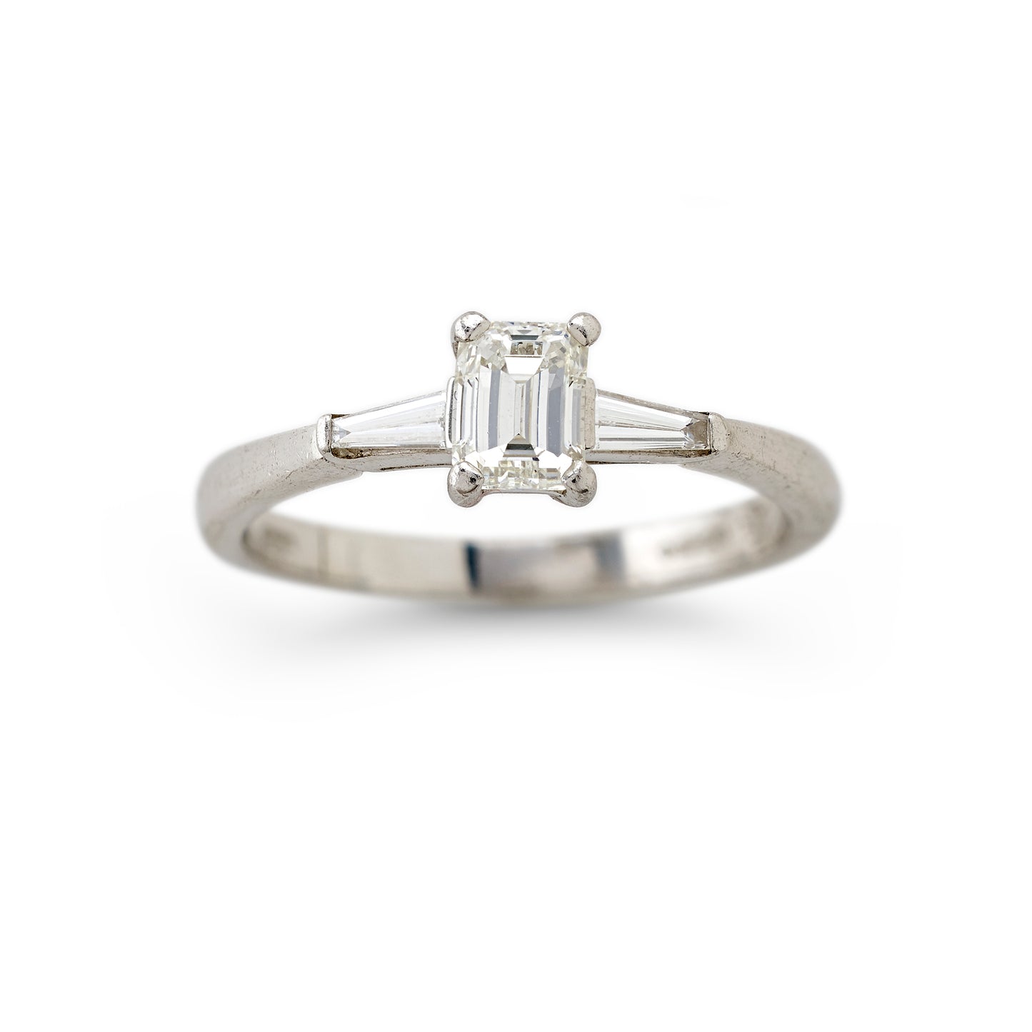 Emerald cut and tapered baguette cut diamond ring