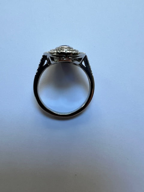 Oval sapphire and diamond double cluster ring