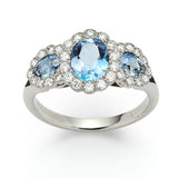 Medium aquamarine and diamond triple cluster engagement ring