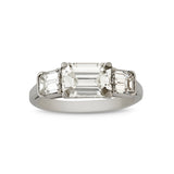 Emerald cut diamond three stone engagement ring