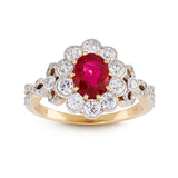 Oval ruby and brilliant cut diamond cluster engagement ring