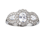 Oval and pear shaped diamond triple cluster engagement ring