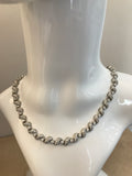 1960's brilliant cut diamond collet and scroll link necklace