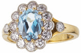 Aquamarine and diamond cluster engagement ring